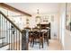 Dining room featuring a rustic table with seating for six, stylish light fixture and hardwood floors at 3139 Fairview Dr, Snellville, GA 30078