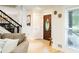 Inviting entryway with hardwood floors, staircase, and a decorative front door with stained glass details at 3139 Fairview Dr, Snellville, GA 30078