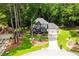 Charming home with well-manicured landscaping, driveway, and a welcoming front porch at 3139 Fairview Dr, Snellville, GA 30078