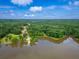 Beautiful aerial view of a wooded homesite with lake access and a private dock at 410 Iroquois Ct, Covington, GA 30014