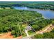 Aerial view showcasing the property's boundary lines and the home's location amidst lush greenery at 410 Iroquois Ct, Covington, GA 30014