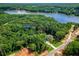 Aerial view of 410 Iroquois Court, Covington, Georgia, nestled among trees and near a lake at 410 Iroquois Ct, Covington, GA 30014