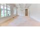 Bright dining room featuring a modern chandelier, coffered ceilings, and large windows allowing ample natural light at 410 Iroquois Ct, Covington, GA 30014