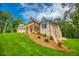 Charming new construction home with a covered porch, manicured landscaping, and a lush lawn at 410 Iroquois Ct, Covington, GA 30014