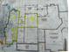 Detailed floor plan showcasing the home's layout, including the basement and garage, with notes and highlighted areas at 410 Iroquois Ct, Covington, GA 30014