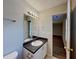 Bathroom featuring a vanity sink with an open door to a hallway and bedroom at 155 Fairclift Dr, Covington, GA 30016