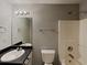 Bathroom featuring a shower-tub combo, vanity with a black countertop, and modern fixtures at 155 Fairclift Dr, Covington, GA 30016