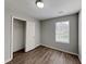 Bedroom featuring a closet, wood floors, and a bright window at 155 Fairclift Dr, Covington, GA 30016