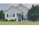 Charming single story home with a manicured lawn and a black front door at 155 Fairclift Dr, Covington, GA 30016