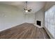 Bright living room with a fireplace, wood floors, and vaulted ceiling at 155 Fairclift Dr, Covington, GA 30016