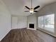 Bright living room featuring a fireplace, wood floors, and vaulted ceiling at 155 Fairclift Dr, Covington, GA 30016