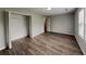 Spacious main bedroom featuring wood floors, ceiling fan, and a walk-in closet at 155 Fairclift Dr, Covington, GA 30016