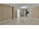 Basement with wood paneling, tile floors, and access to other rooms of the house at 178 Castleair Ne Dr, Kennesaw, GA 30144