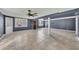 Finished basement featuring tile floors, a ceiling fan, and a walk-out exit at 178 Castleair Ne Dr, Kennesaw, GA 30144