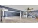 Spacious finished basement with tile floors, utility closet, and access to the upper floor at 178 Castleair Ne Dr, Kennesaw, GA 30144