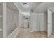 Basement bathroom with a shower-tub combo, vanity, and closet for organized storage at 178 Castleair Ne Dr, Kennesaw, GA 30144