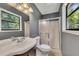 Bathroom boasts an updated vanity, shower, and plenty of light at 178 Castleair Ne Dr, Kennesaw, GA 30144