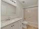 Bathroom features a single sink vanity, toilet, and shower-tub combo at 178 Castleair Ne Dr, Kennesaw, GA 30144