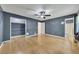 Spacious bedroom includes a ceiling fan, hardwood floors, and has an attached bathroom at 178 Castleair Ne Dr, Kennesaw, GA 30144