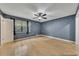 Bedroom featuring hardwood floors, a ceiling fan, and a window at 178 Castleair Ne Dr, Kennesaw, GA 30144