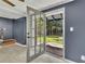 Sunlit entryway boasts a tiled floor and a glass paneled door leading to the landscaped backyard at 178 Castleair Ne Dr, Kennesaw, GA 30144