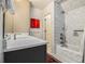 Bathroom features a marble countertop, subway tile shower, and classic black and white patterned rug at 1833 N Rock Springs Ne Rd, Atlanta, GA 30324