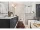 Luxurious bathroom with marble walls, a soaking tub, and a glass-enclosed shower for a spa-like experience at 1833 N Rock Springs Ne Rd, Atlanta, GA 30324