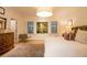 Bright bedroom with a tufted headboard, white walls, and a decorative rug for added comfort at 1833 N Rock Springs Ne Rd, Atlanta, GA 30324