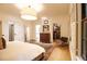 Calm and bright bedroom with a large bed, a dresser, and a doorway to a walk-in closet at 1833 N Rock Springs Ne Rd, Atlanta, GA 30324