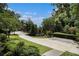 Long driveway leading to the property through a well-manicured lawn and mature trees at 1833 N Rock Springs Ne Rd, Atlanta, GA 30324