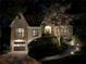 Exterior view of home at night featuring lovely landscape lighting and a garage at 1833 N Rock Springs Ne Rd, Atlanta, GA 30324