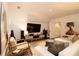Bright living room has a white sofa, large artwork, and natural light from window with shutters at 1833 N Rock Springs Ne Rd, Atlanta, GA 30324