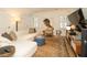 Bright living room has a white sofa, large artwork, and natural light from window with shutters at 1833 N Rock Springs Ne Rd, Atlanta, GA 30324