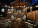 Backyard patio featuring an outdoor fireplace, Adirondack chairs, and a covered porch at 1833 N Rock Springs Ne Rd, Atlanta, GA 30324
