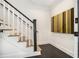 Stylish staircase with white railings, dark wood accents, and herringbone floor, adding character to the home at 1833 N Rock Springs Ne Rd, Atlanta, GA 30324