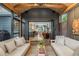 Cozy screened-in porch with comfortable seating, stylish decor, and an open view to indoor living spaces at 1833 N Rock Springs Ne Rd, Atlanta, GA 30324