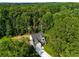Aerial view of the home nestled amongst mature trees at 4140 Camaron Way, Snellville, GA 30039