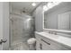Bright modern bathroom with a glass-enclosed shower and stylish vanity mirror at 4140 Camaron Way, Snellville, GA 30039