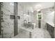 Modern bathroom featuring marble floors, glass shower, and double sink vanity at 4140 Camaron Way, Snellville, GA 30039