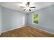 Bedroom featuring new flooring and a window overlooking the outdoor greenery at 4140 Camaron Way, Snellville, GA 30039
