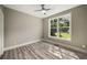 Cozy bedroom with a large window allowing ample sunlight and a view of the outdoors at 4140 Camaron Way, Snellville, GA 30039