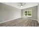 Bedroom features hardwood floors, ceiling fan and natural light from the windows at 4140 Camaron Way, Snellville, GA 30039