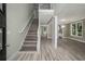 Inviting foyer with hardwood floors and staircase, leading to an open living space at 4140 Camaron Way, Snellville, GA 30039