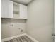 Functional laundry room with upper cabinets and utility connections at 4140 Camaron Way, Snellville, GA 30039