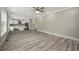 Spacious living room adjacent to a modern kitchen, featuring neutral tones and hardwood floors at 4140 Camaron Way, Snellville, GA 30039
