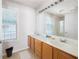 Bathroom features a double sink vanity, large mirror, and a shower, offering functionality and style at 5069 Kathryn Glen Dr, Acworth, GA 30101
