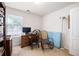 Cozy bedroom space with window for natural light, furnished with a desk and comfortable chairs at 5069 Kathryn Glen Dr, Acworth, GA 30101