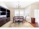 This dining room offers a large window, chandelier and a built in bookcase at 5069 Kathryn Glen Dr, Acworth, GA 30101