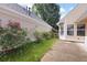 Exterior view of home with siding and garden, with sidewalk leading around the property at 5069 Kathryn Glen Dr, Acworth, GA 30101