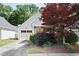Home exterior with driveway, lawn, landscaping, and a two-car garage at 5069 Kathryn Glen Dr, Acworth, GA 30101